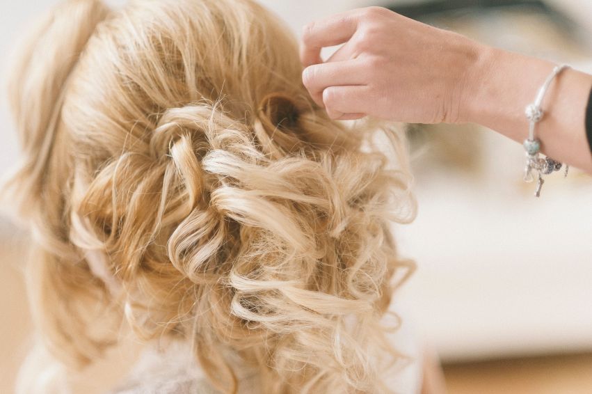 Styled blonde updo viewed from behind
